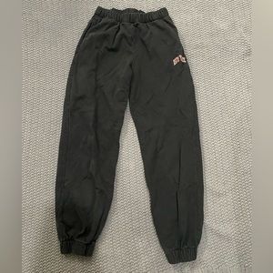 black brandy Melville sweatpants with “new york” on pant-leg. fits size small